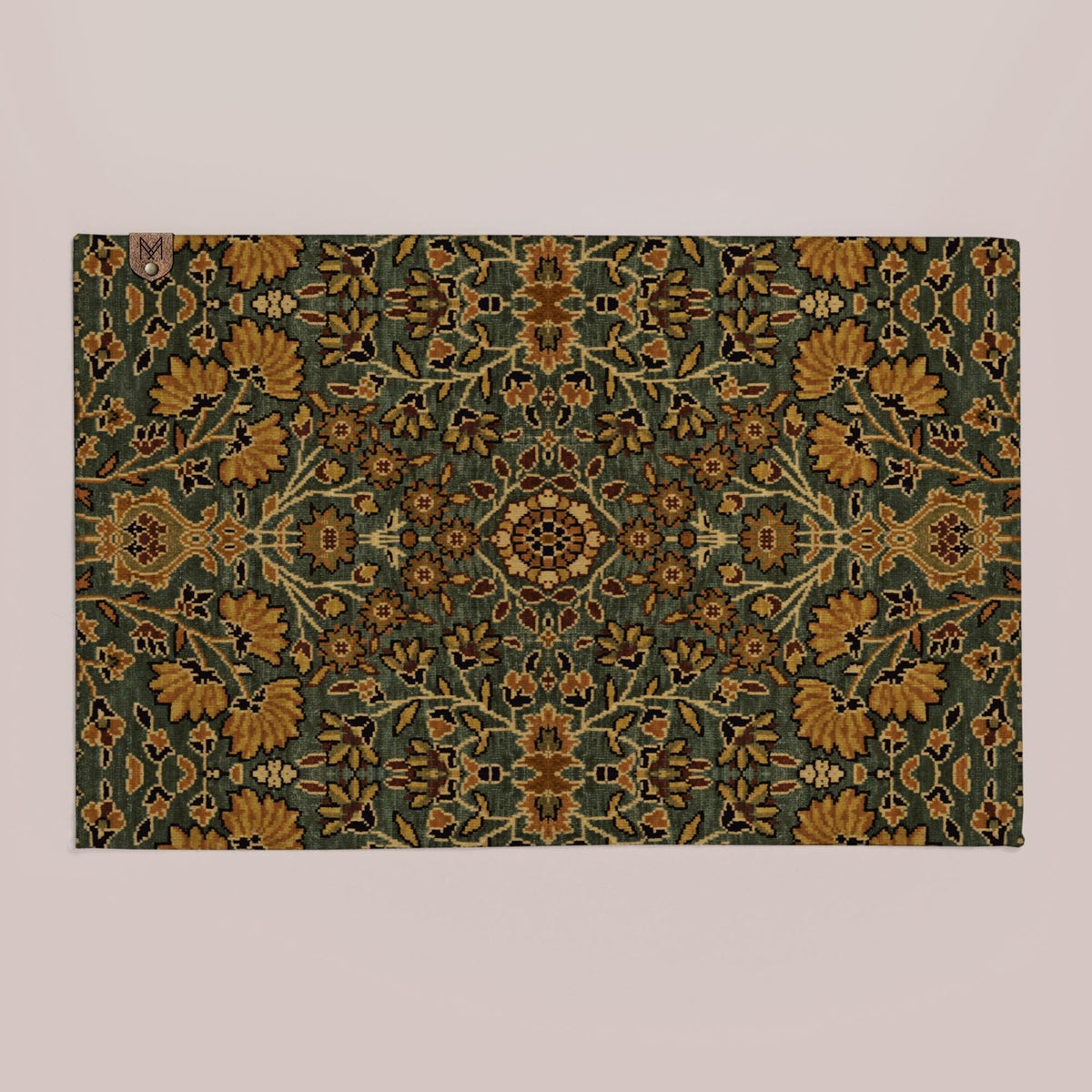 a large, ornate rug with a floral pattern in shades of green and gold.