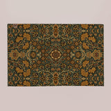 a large, ornate rug with a floral pattern in shades of green and gold.